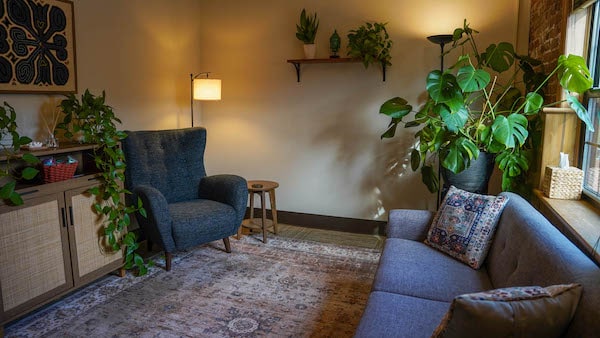 Cosy Montclair therapy office with lamp and plants