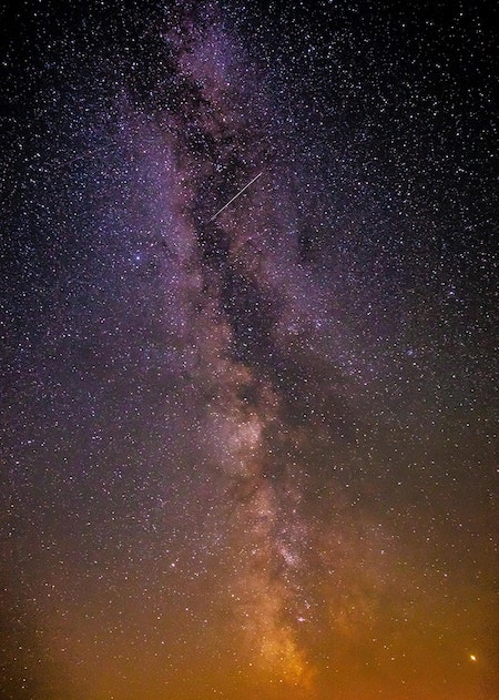 night sky showing milky way and shooting star