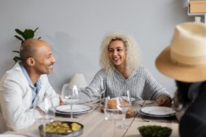 smiling-people-at-table-with-food