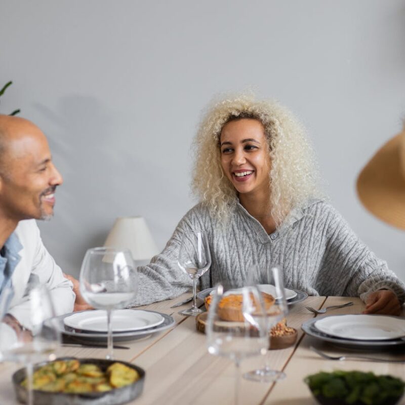 smiling-people-at-table-with-food